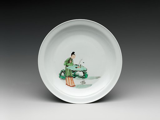 Dish with woman and rabbit in a garden