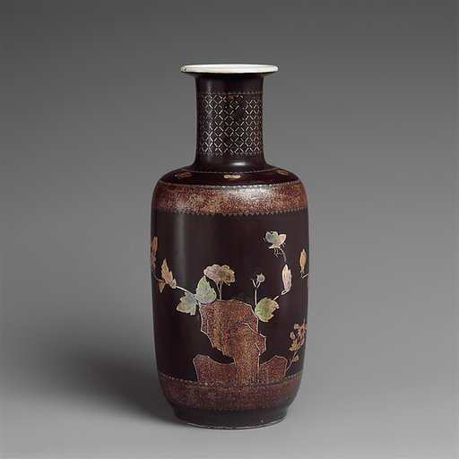 Vase with decoration of rocks, flowers, and butterflies