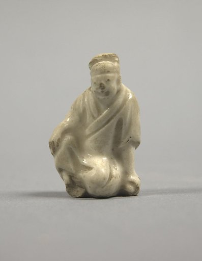 Figure of a seated man