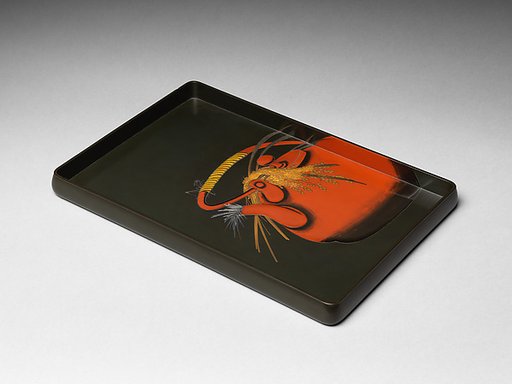 Tray with rice stalks and a grasshopper on a tea kettle