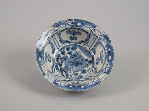Bowl decorated with flowers and beast faces