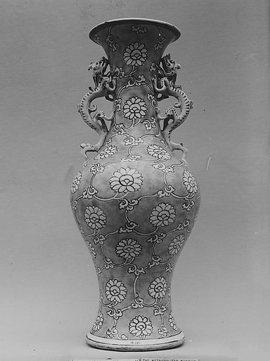 Vase with floral scrolls and dragon handles
