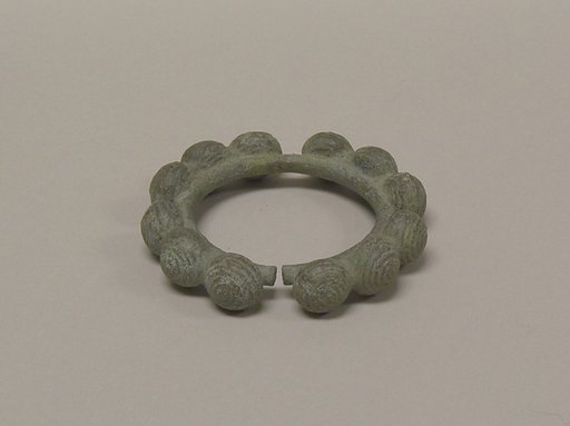 One from a Pair of Bangles with Ball Decorations