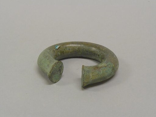 One from a Pair of Solid Open Bangles with Shaved Ends