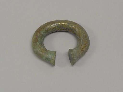 One from a Pair of Solid Open Bangles with Shaved Ends
