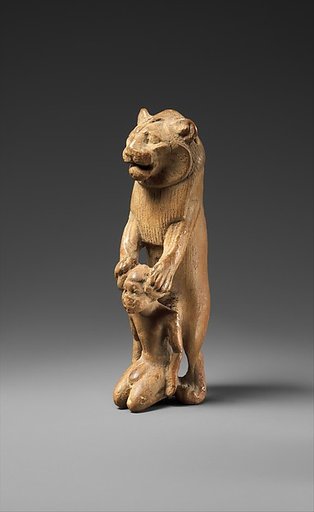 Statuette of lion holding a Nubian captive