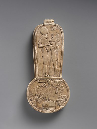Counterweight of a <em>menit</em> necklace with an image of Bastet nursing King Taharqo