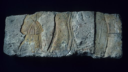 Relief with royal person and courtiers
