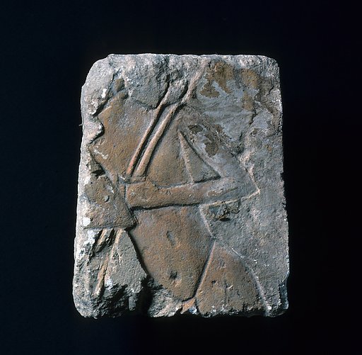 Relief with torso of a guard