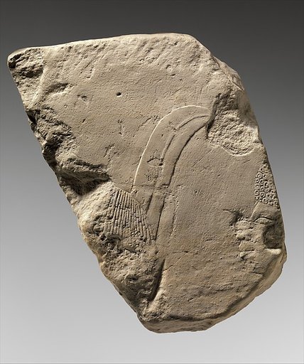 Relief fragment: foreigner with feather in his hair and Nubian
