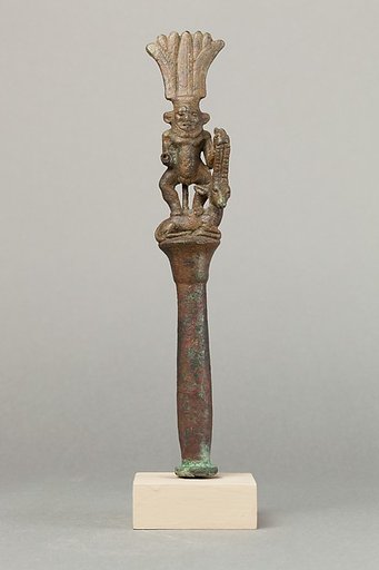Papyrus pillar surmounted by Bes with an antelope