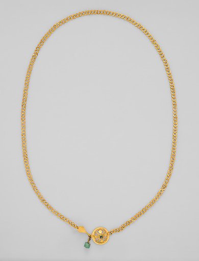 Chain terminating in a leaf motif, and having a raised openwork clasp ornament
