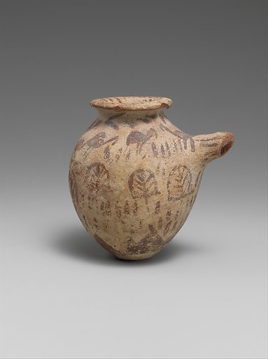 Spouted vessel in decorated ware