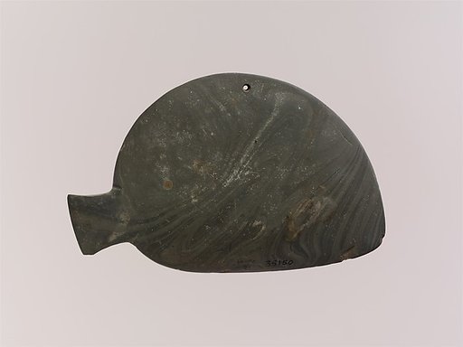 Fish-shaped palette with the remains of green pigment