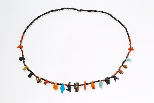 Necklace with disc beads and amulets