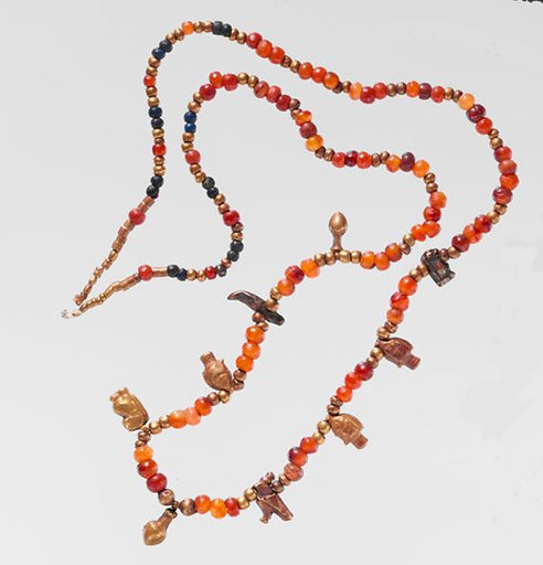 Necklace of ball beads and gold amulets