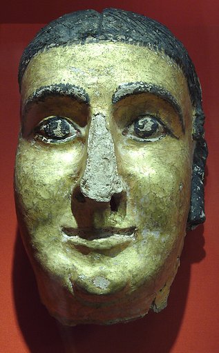 Mask of a woman with cosmetic lines and gilding