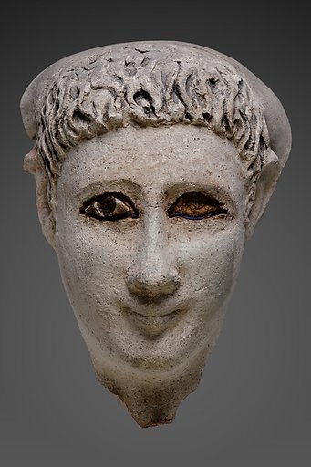 Mask of a man with loose hair combed forward and a mantle