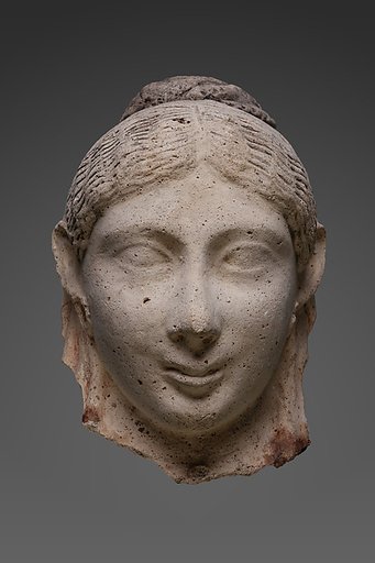 Mask of a woman with an austere hairstyle