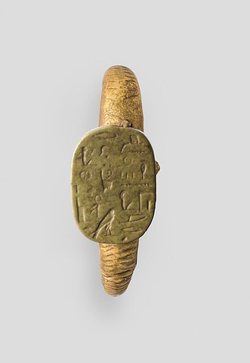 Ridged earring with an Egyptian Late Period hieroglyphic plaque as ornament