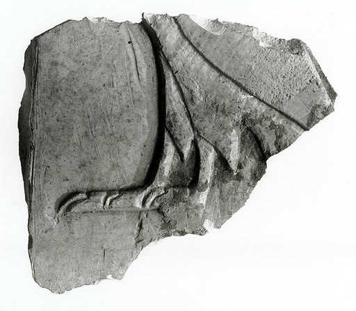 Raised relief fragment depicting a hieroglyph