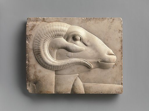 Relief plaque with the head of a ram deity