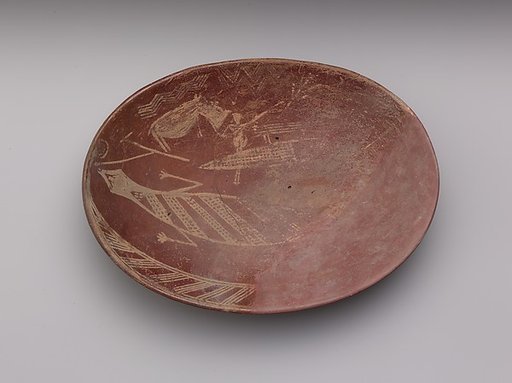 A shallow white cross-lined ware bowl illustrating a man on a boat alongside a hippo and crocodile