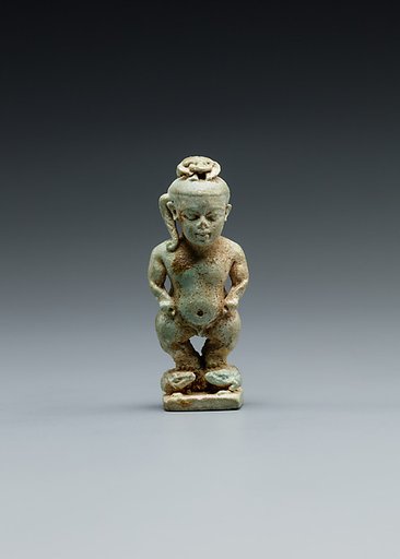 Amulet: Pataikos astride crocodiles and with a scarab on his head