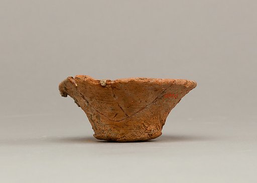 Bowl with stones and carnelian bead
