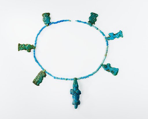 Seven Amulets on a String of Beads