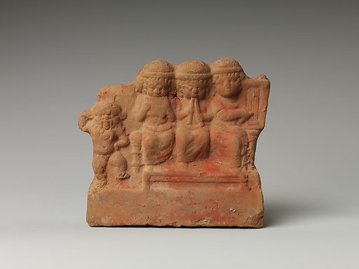 Dancing Bes alongside seated group of musicians