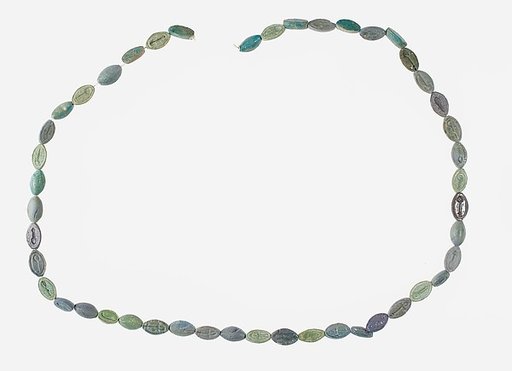 String of 46 Cowroids Inscribed with Various Hieroglyphs