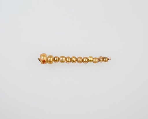 String of 12 elongated disc beads