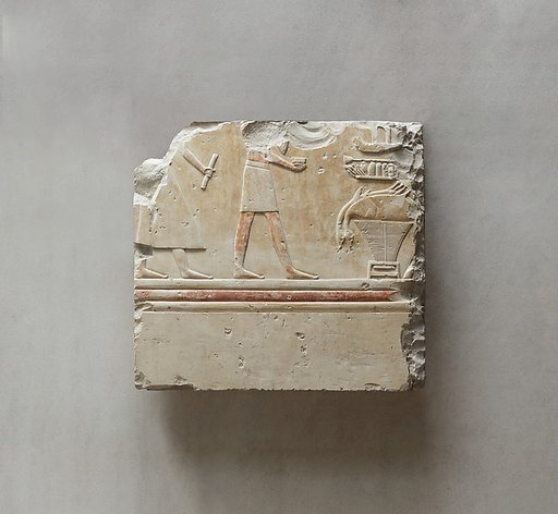 Relief from the tomb of Queen Neferu: a scribe and a cupbearer approach the queen's offering table