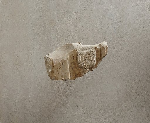 Relief fragment of a perfume press