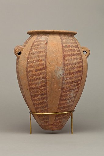 Decorated ware jar with vertical bands of wavy lines