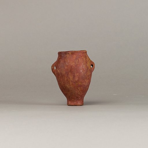 Polished red ware jar with lugs