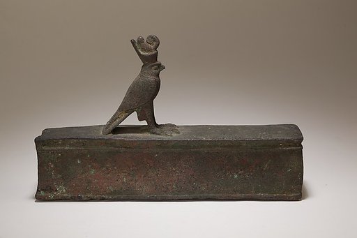 Case for an animal mummy topped by a falcon