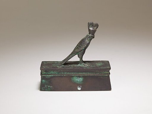Falcon in double crown surmounting a shrine-shaped box for an animal mummy