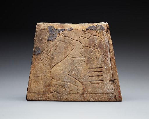 Wooden block with bound prisoner