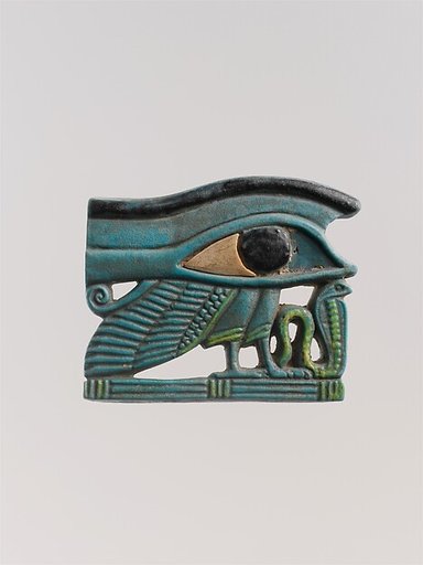 <em>Wedjat</em> eye amulet with a wing and other elements