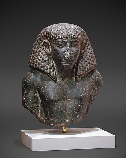 Upper Part of a Statue of a Man