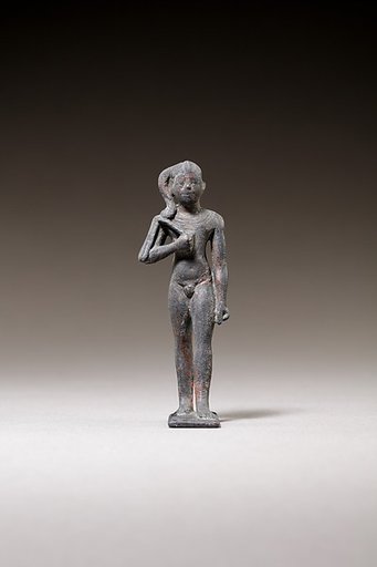 Child god standing and holding a flail