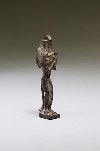 Nehebkau (snake deity) holding a wedjat eye