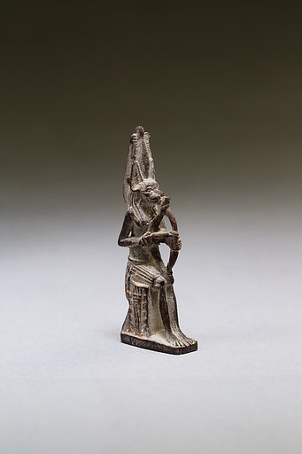 Seated polymorphic figure of jackal-headed archer