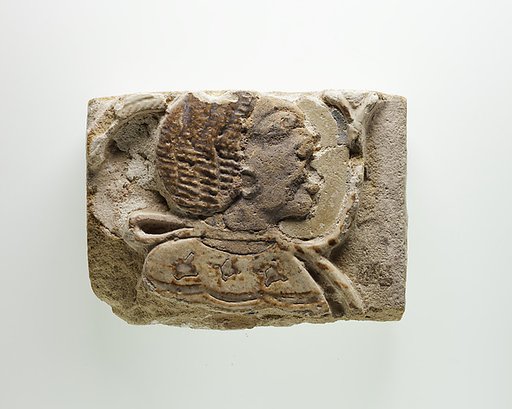 Tile fragment with a head of a prisoner
