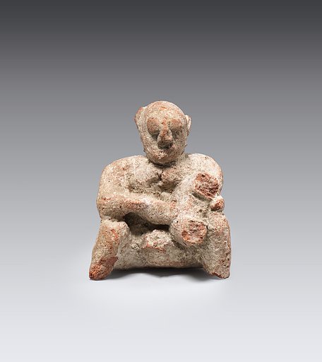 Figure of a seated man