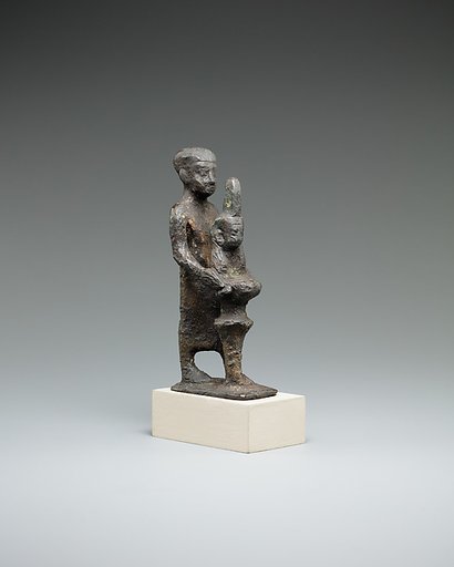 Individual holding a Maat bust on a stand