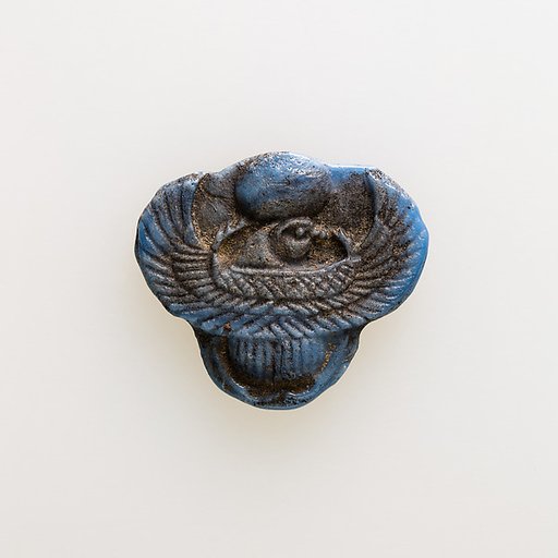 Amulet of winged scarab with falcon head