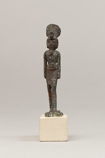 God wearing disk and uraeus on a short wig